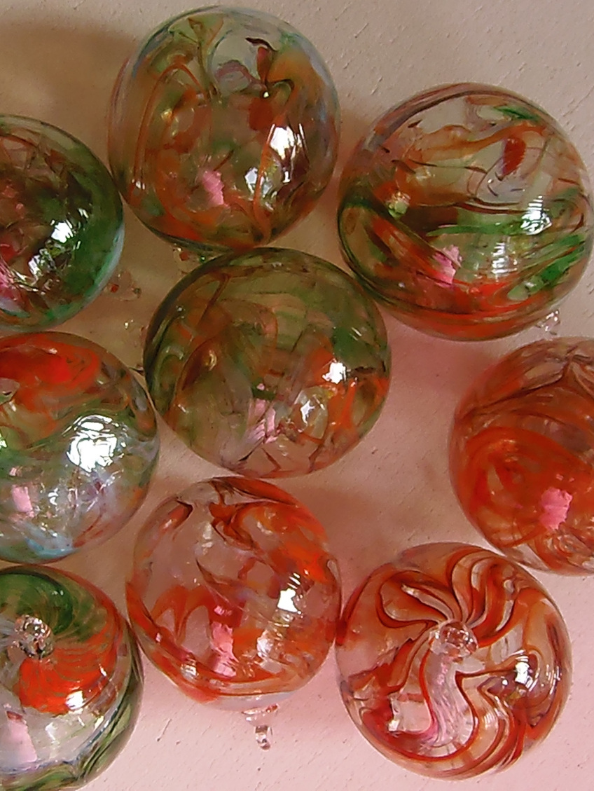 Collection of blown glass ornaments in red and green