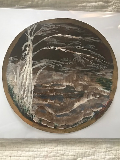 Small detailed painting of a village at nighttime on glass circle
